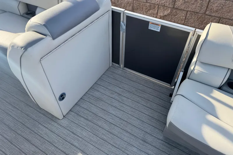 Slide: The Image of 2019 Starcraft EX 20 C boat interior with gray seating and flooring. - 13