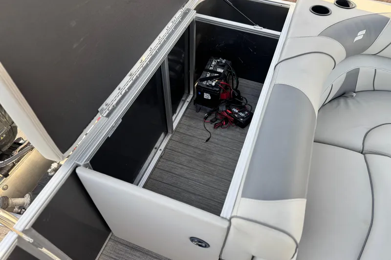 Slide: The Image of 2019 Starcraft EX 20 C boat interior storage with battery and wiring. - 17