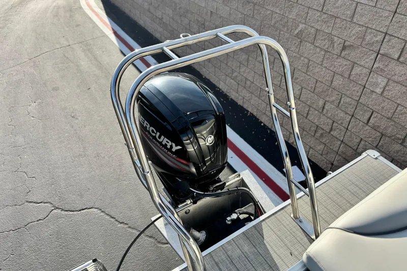 Slide: The Image of 2019 Starcraft EX 20 C boat with Mercury outboard motor and stainless steel ladder. - 18