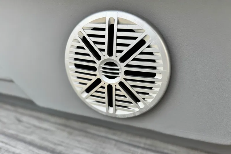 Slide: The Image of Close-up of a 2019 Starcraft EX 20 C boat speaker grille. - 20