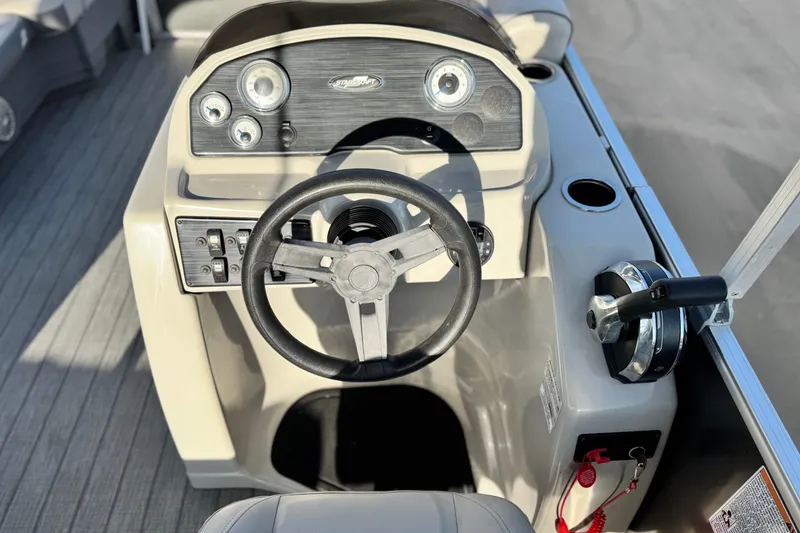 Slide: The Image of Steering console of 2019 Starcraft EX 20 C boat with controls and gauges. - 22