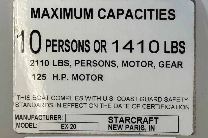 Slide: The Image of 2019 Starcraft EX 20 C boat capacity label: 10 persons or 1410 lbs, 125 HP motor. - 26