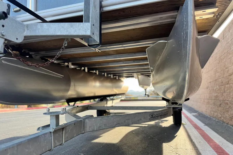 Slide: The Image of Underneath view of a 2019 Starcraft EX 20 C pontoon boat on a trailer. - 4