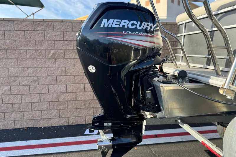 Slide: The Image of 2019 Starcraft EX 20 C with Mercury FourStroke outboard motor, parked on a trailer. - 7