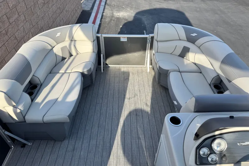Slide: The Image of 2019 Starcraft EX 20 C pontoon boat interior with plush seating and modern design. - 9