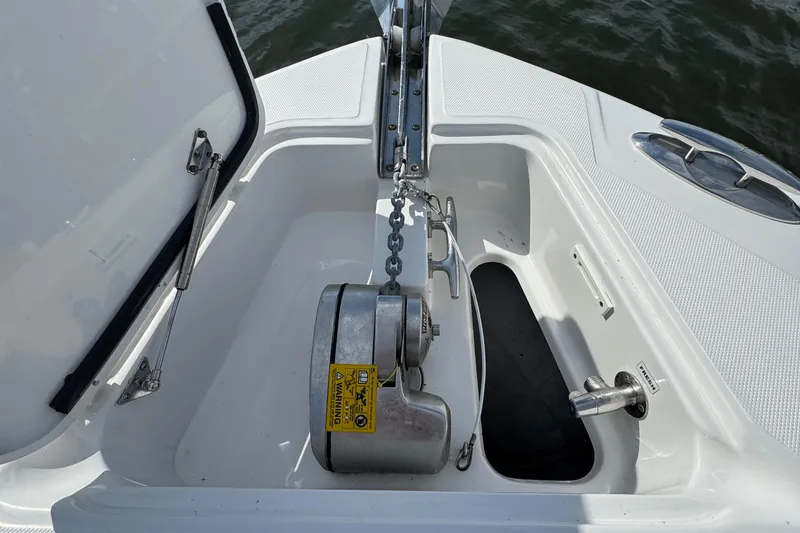 Slide: The Image of Anchor compartment of 2016 Edgewater 320CC boat with chain and winch system. - 11