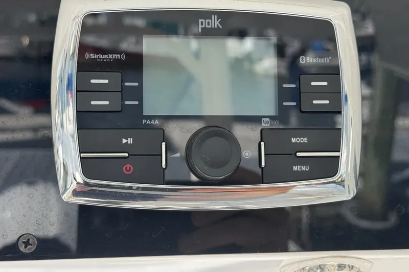 Slide: The Image of Polk audio system on 2016 Edgewater 320CC boat, featuring Bluetooth and SiriusXM readiness. - 16