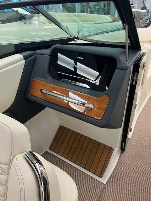 Slide: The Image of Interior of 2025 Chris-Craft Sportster 25, featuring elegant wood accents and modern design. - 11