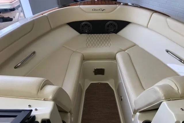 Slide: The Image of Luxurious interior of 2025 Chris-Craft Sportster 25 boat with cream leather seating. - 14