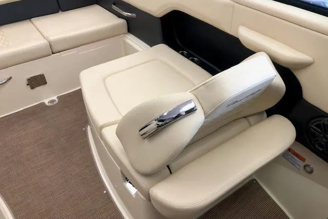 Slide: The Image of 2025 Chris-Craft Sportster 25 interior with beige leather seating and modern design. - 15
