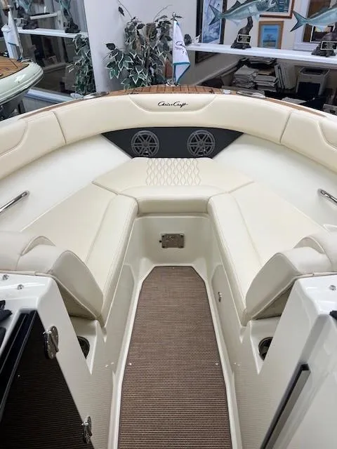 Slide: The Image of Luxurious 2025 Chris-Craft Sportster 25 boat interior with cream seating and modern design. - 3