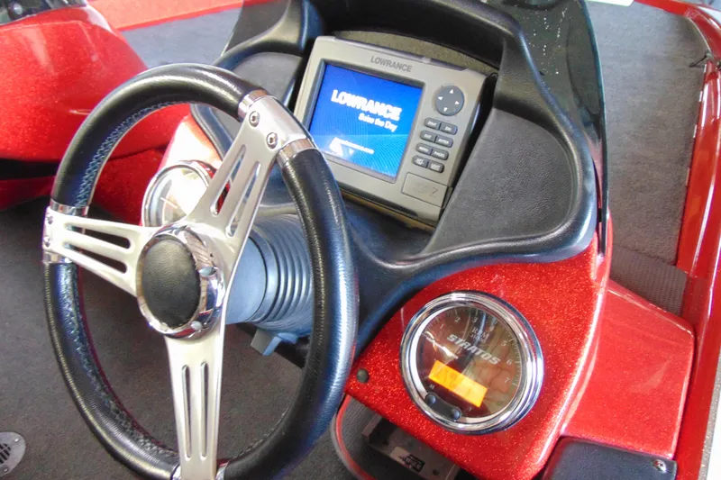 Slide: The Image of Steering wheel and dashboard of 2011 Stratos 183 Elite boat with Lowrance display. - 11