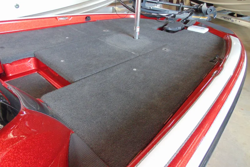 Slide: The Image of 2011 Stratos 183 Elite boat deck with red accents and carpeted surface. - 13