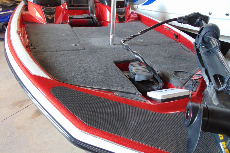 Slide: The Image of 2011 Stratos 183 Elite boat deck with red accents and fishing equipment. - 14