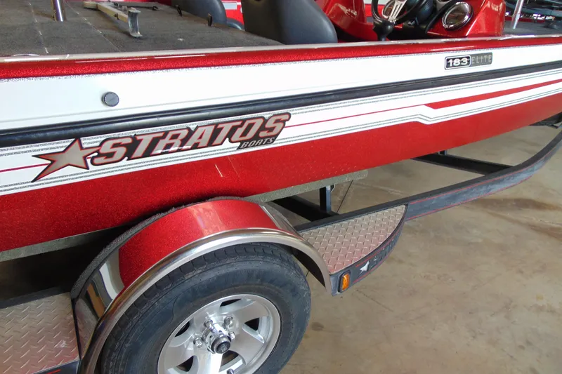 Slide: The Image of 2011 Stratos 183 Elite boat with red and white detailing on a trailer. - 2