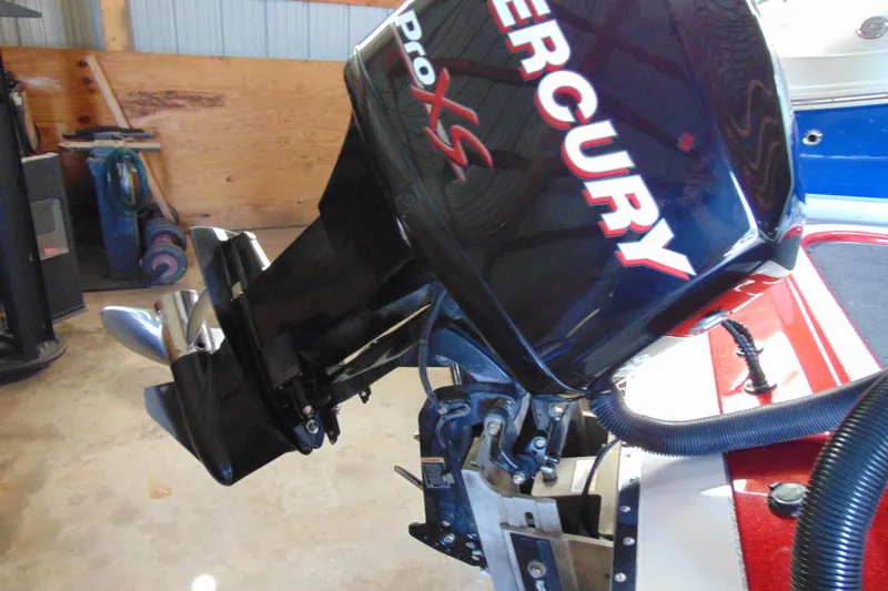 Slide: The Image of Mercury Pro XS outboard motor on 2011 Stratos 183 Elite boat in garage. - 5