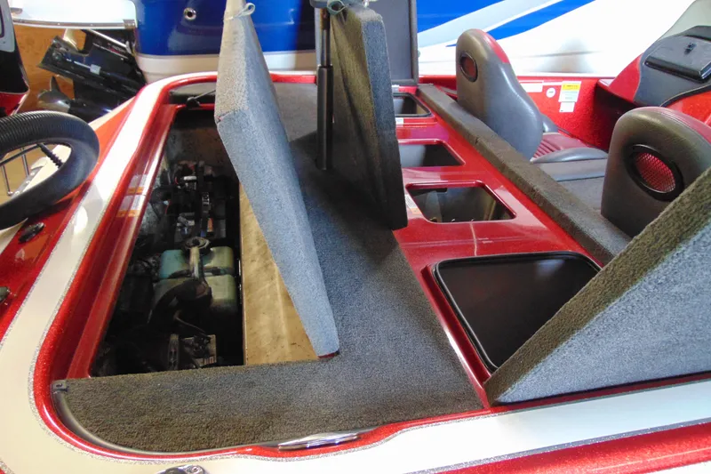 Slide: The Image of 2011 Stratos 183 Elite boat interior with open storage compartments and seating. - 7
