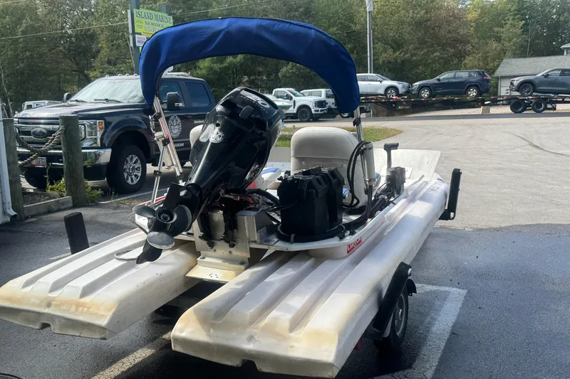 Slide: The Image of 2009 CraigCat custom boat with motor on trailer at Island Marine Service. - 6