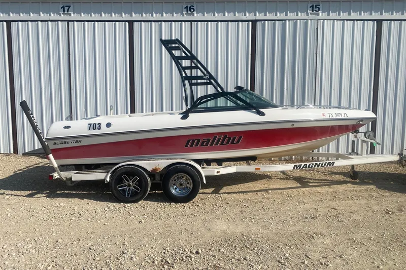 The Image of 2003 Malibu Sunsetter 21 XTi boat on trailer, parked outdoors. - 0