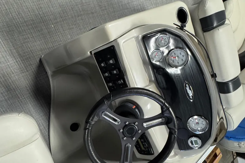 Slide: The Image of 2017 Starcraft EX 21 R boat dashboard with steering wheel and gauges. - 10