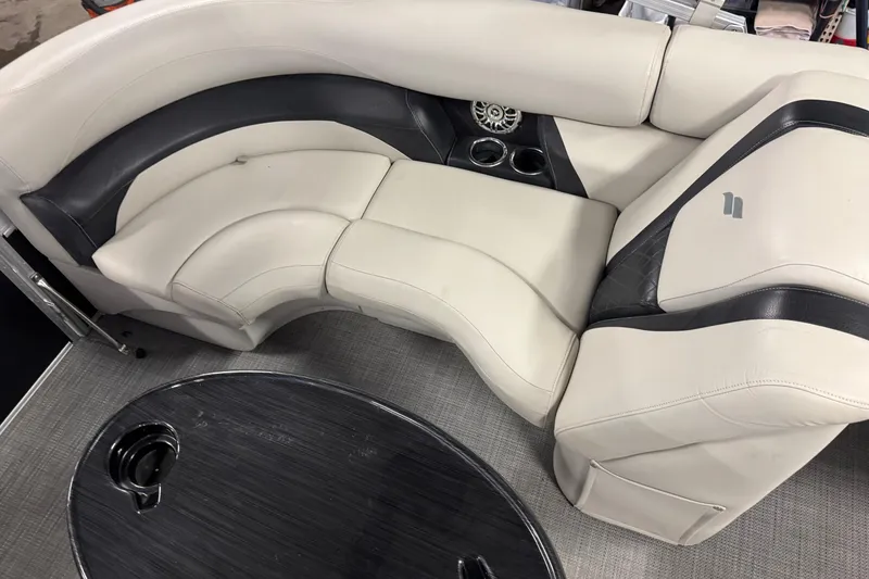 Slide: The Image of Luxurious seating in a 2017 Starcraft EX 21 R boat with cup holders and table. - 15