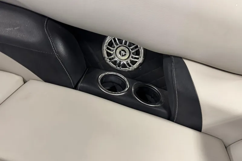 Slide: The Image of 2017 Starcraft EX 21 R boat interior with speaker and cup holders. - 16
