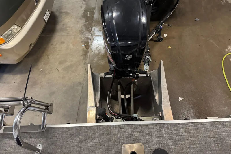 Slide: The Image of 2017 Starcraft EX 21 R boat motor in a garage setting. - 17