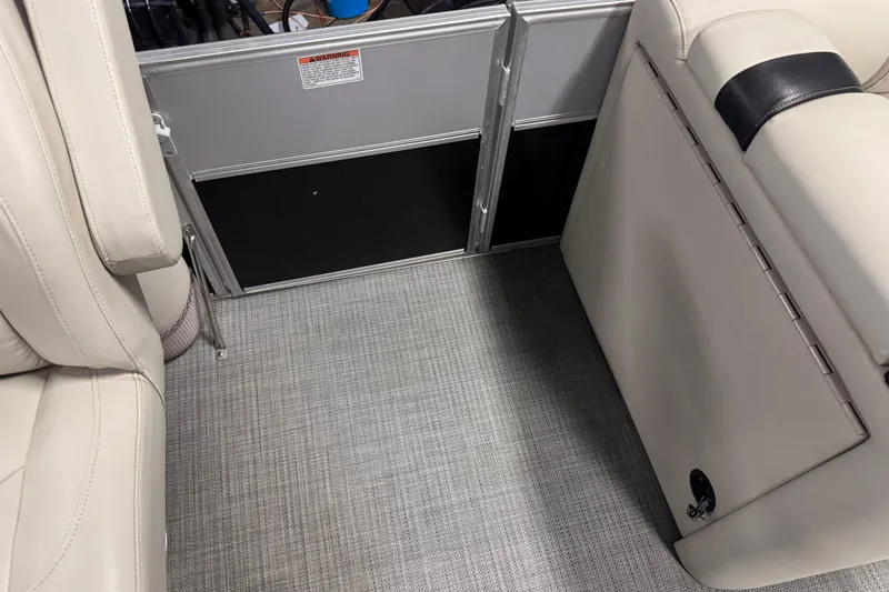 Slide: The Image of Interior of 2017 Starcraft EX 21 R boat with beige seating and gray flooring. - 18