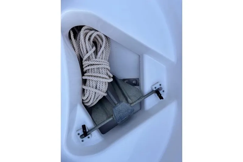 Slide: The Image of 2013 Yamaha AR192 boat anchor compartment with coiled rope. - 13