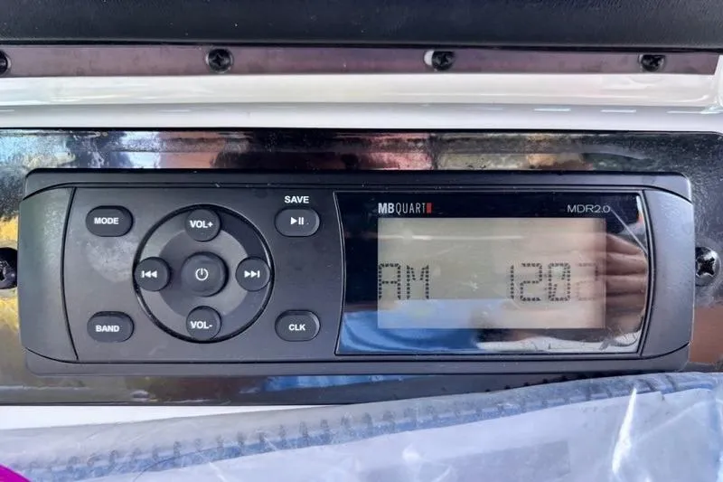 Slide: The Image of Control panel of a 2013 Yamaha Boats AR192, displaying FM radio settings. - 22