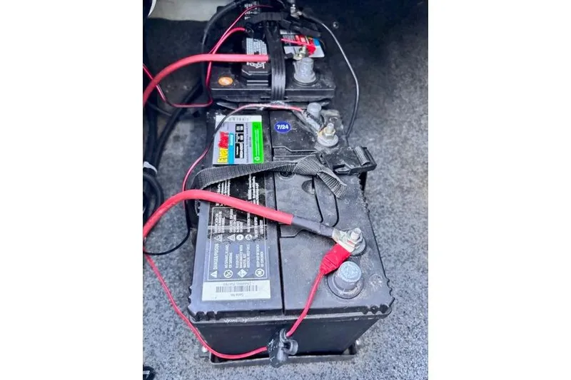 Slide: The Image of Batteries in a 2013 Yamaha Boats AR192, connected with red and black cables. - 26
