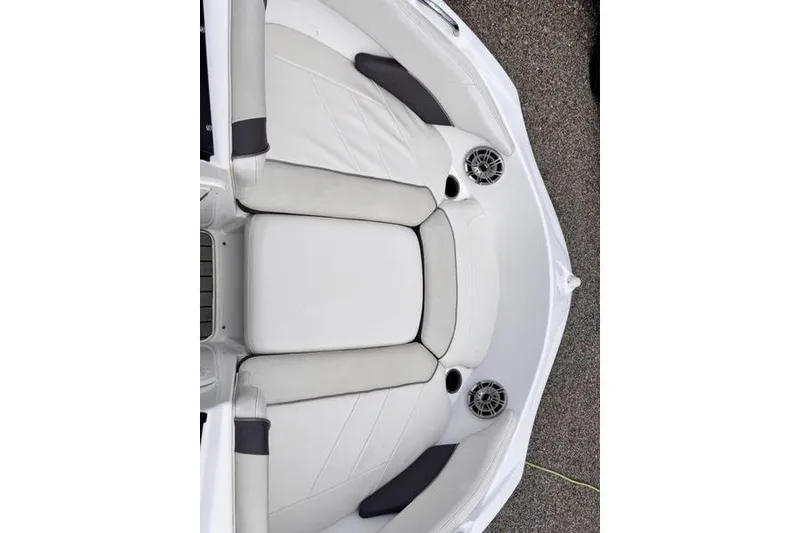 Slide: The Image of 2013 Yamaha Boats AR192 interior seating with speakers, featuring white and gray upholstery. - 29
