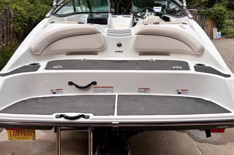 Slide: The Image of 2013 Yamaha Boats AR192, rear view, showcasing swim platform and seating area. - 32