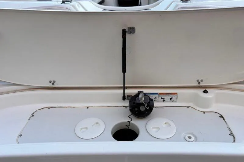 Slide: The Image of 2013 Yamaha AR192 boat storage compartment with open hatch and visible components. - 7