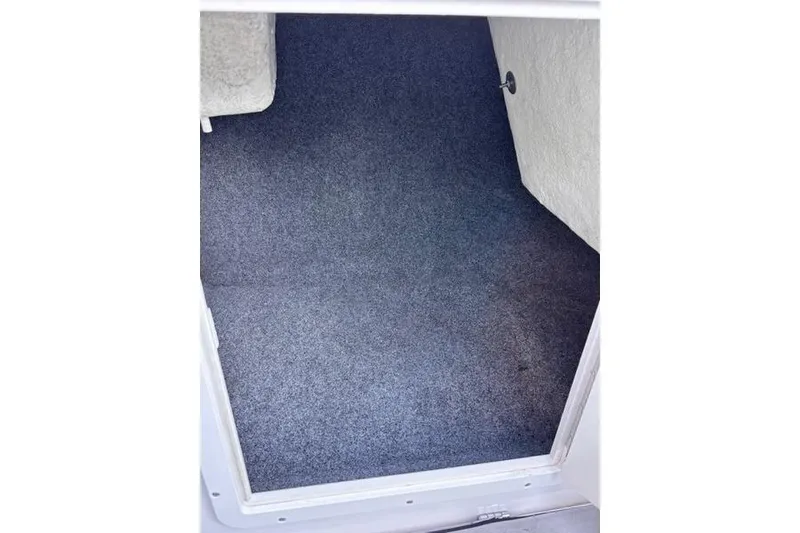 Slide: The Image of Carpeted storage compartment in a 2013 Yamaha Boats AR192. - 9