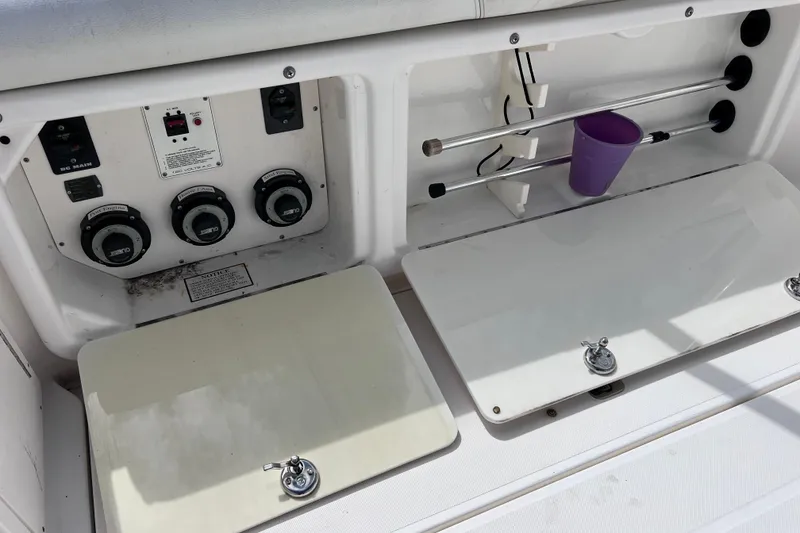 Slide: The Image of Control panel and storage area on 2005 Century 3200 Walk-Around boat. - 15