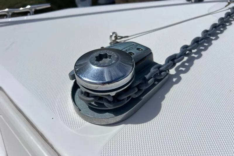 Slide: The Image of Chrome anchor windlass on 2005 Century 3200 Walk-Around boat deck. - 20