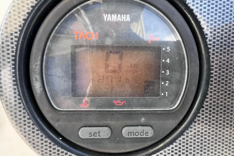 Slide: The Image of Yamaha tachometer on 2005 Century 3200 Walk-Around boat dashboard. - 28