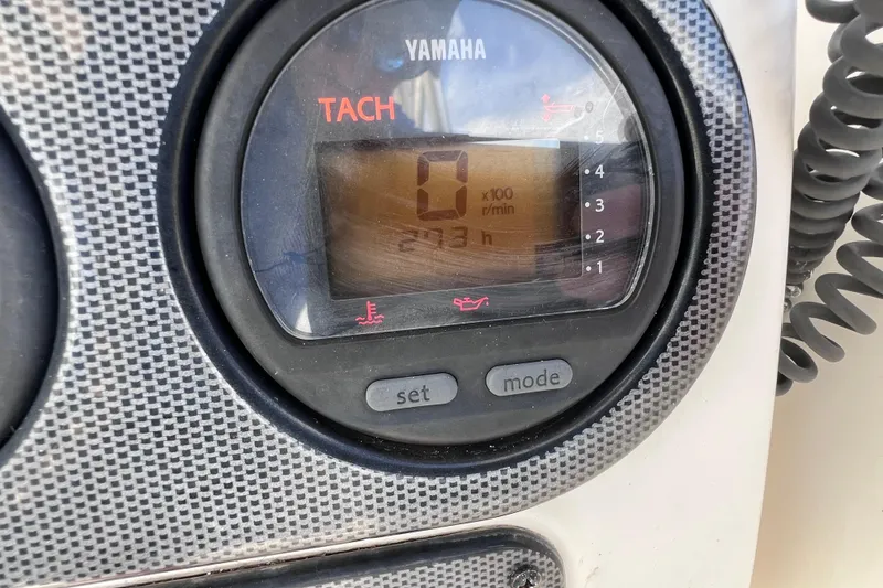 Slide: The Image of Yamaha tachometer on 2005 Century 3200 Walk-Around boat dashboard, displaying 273 hours. - 30