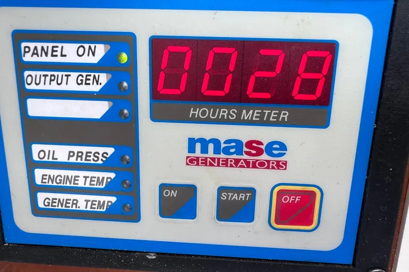 Slide: The Image of 2005 Century 3200 Walk-Around generator panel with 28 hours on Mase Generators meter. - 52