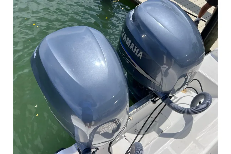 Slide: The Image of Twin Yamaha outboard motors on a 2005 Century 3200 Walk-Around boat. - 62