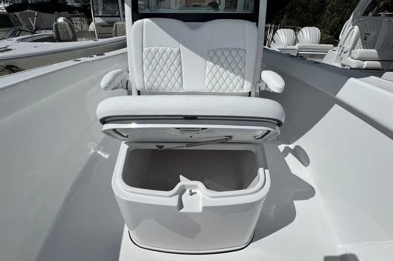 Slide: The Image of 2026 Sportsman Heritage 321 Center Console with open storage compartment and cushioned seating. - 10