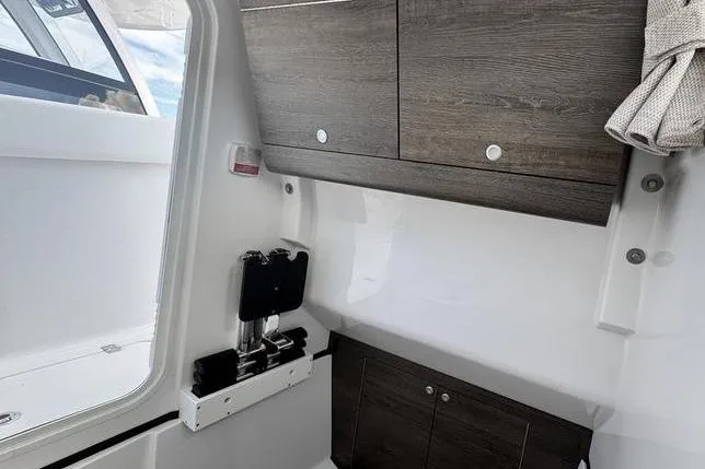 Slide: The Image of 2026 Sportsman Heritage 321 Center Console interior with sleek cabinetry and modern design. - 13