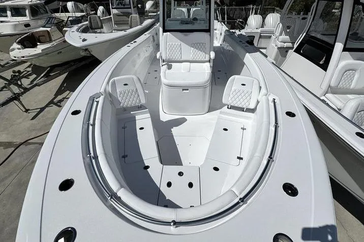 Slide: The Image of 2026 Sportsman Heritage 321 Center Console boat with spacious seating and sleek design. - 4