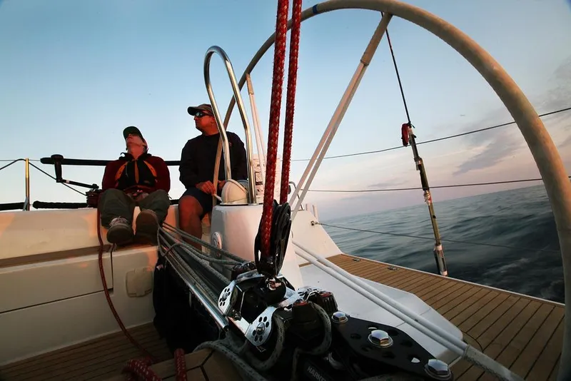 Slide: The Image of Two people relaxing on a 2003 Grand Soleil 44 sailboat at sunset. - 18