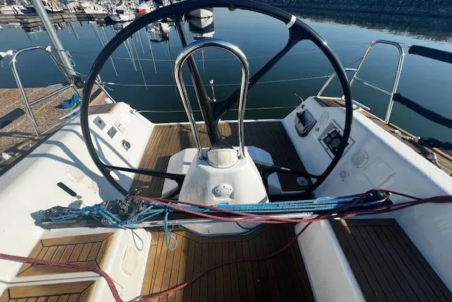 Slide: The Image of Cockpit of 2003 Grand Soleil 44 sailboat with wooden deck and steering wheel. - 19
