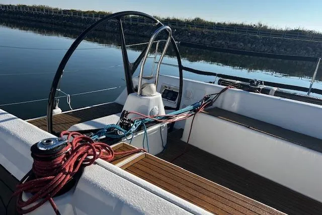 Slide: The Image of Cockpit of 2003 Grand Soleil 44 sailboat with steering wheel and ropes. - 20