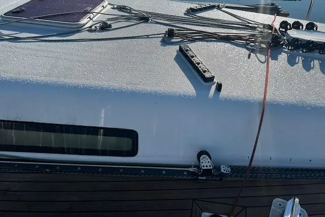Slide: The Image of Deck view of a 2003 Grand Soleil 44 sailboat with rigging and teak accents. - 21