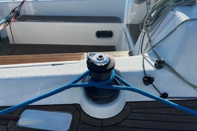 Slide: The Image of Winch and blue rope on 2003 Grand Soleil 44 sailboat deck. - 22