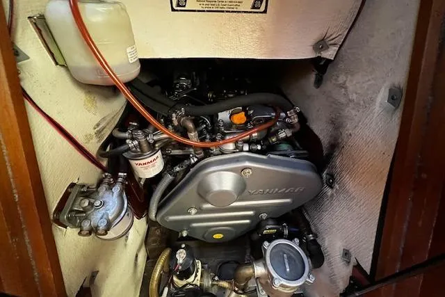 Slide: The Image of Engine compartment of a 2003 Grand Soleil 44 sailboat, featuring a Yanmar engine. - 25